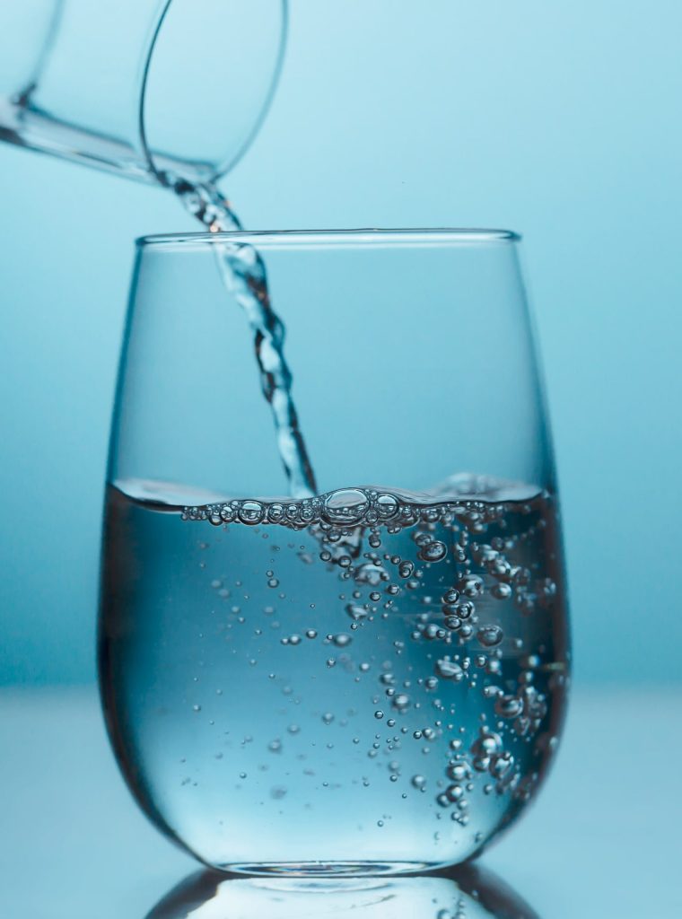 fresh-water-pouring-from-the-glass-jug-into-a-glas-2021-08-30-08-39-29-utc_copy-min